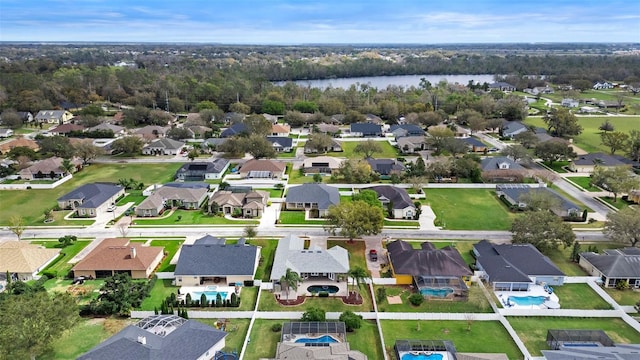 aerial view featuring a residential view and a water view