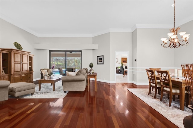 living area featuring ornamental molding, dark wood-style flooring, baseboards, and an inviting chandelier