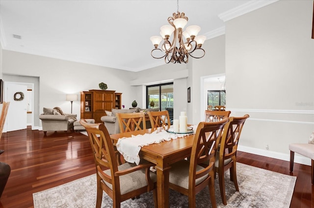 dining area with baseboards, a chandelier, dark wood finished floors, and ornamental molding