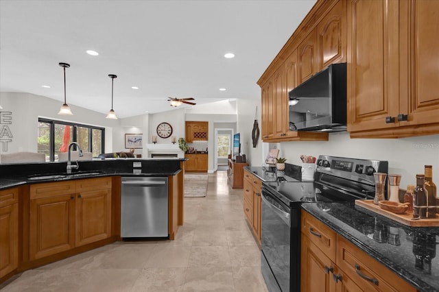 kitchen featuring black appliances, brown cabinets, a sink, and open floor plan