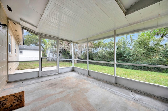 unfurnished sunroom with a wealth of natural light