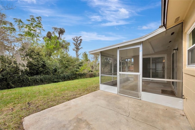 view of patio featuring a sunroom