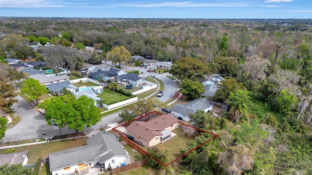 birds eye view of property with a residential view and a view of trees