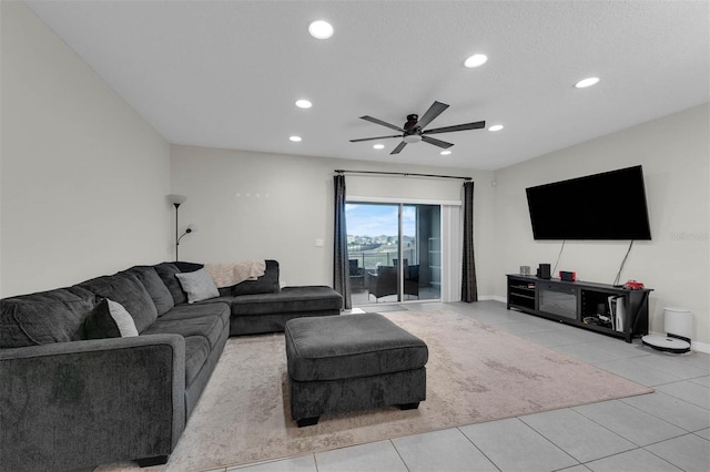 living room featuring light tile patterned floors, ceiling fan, a textured ceiling, and recessed lighting