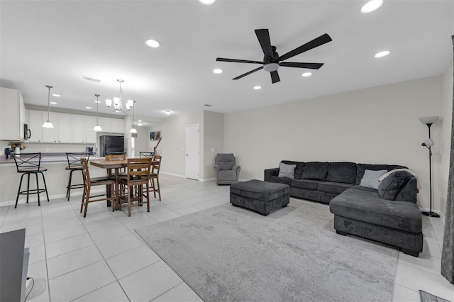 living room with recessed lighting, ceiling fan, baseboards, and light tile patterned floors