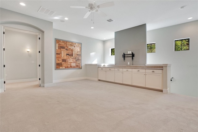 interior space featuring ceiling fan