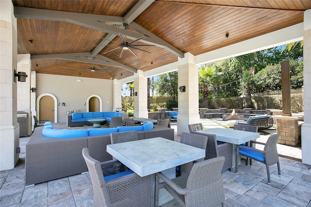 view of patio with an outdoor living space, ceiling fan, and a gazebo