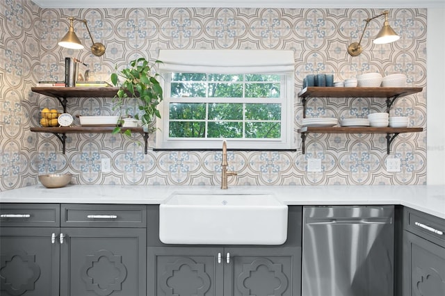 kitchen with gray cabinetry, open shelves, dishwasher, decorative backsplash, and a sink