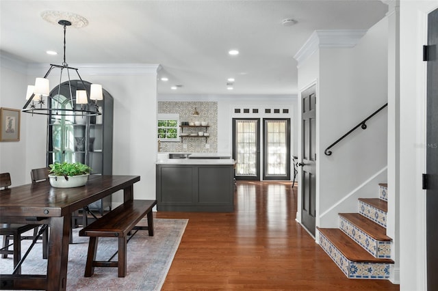 dining room with recessed lighting, stairway, dark wood finished floors, and ornamental molding