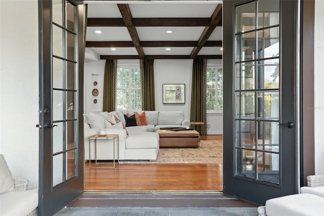 living room featuring recessed lighting, french doors, coffered ceiling, and beamed ceiling