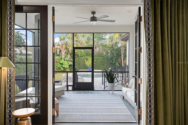 entryway with a wealth of natural light and ceiling fan