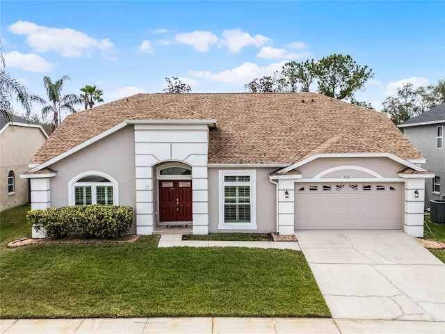 view of front of property with an attached garage, a front lawn, roof with shingles, stucco siding, and driveway