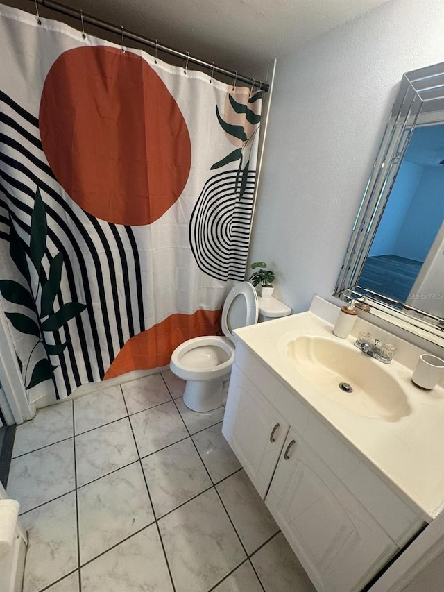 5951 Village Cir Unit Ge, Orlando, FL 32822 - full bath with vanity, tile patterned flooring, and toilet