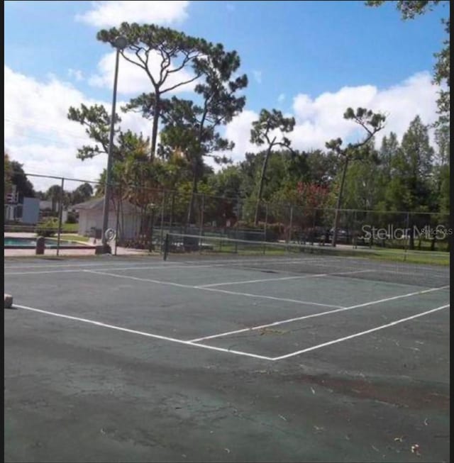 5951 Village Cir Unit Ge, Orlando, FL 32822 - view of tennis court featuring fence