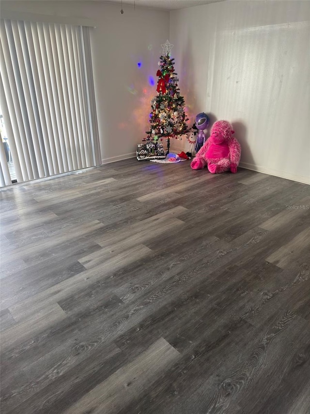 5951 Village Cir Unit Ge, Orlando, FL 32822 - unfurnished room featuring dark wood-type flooring