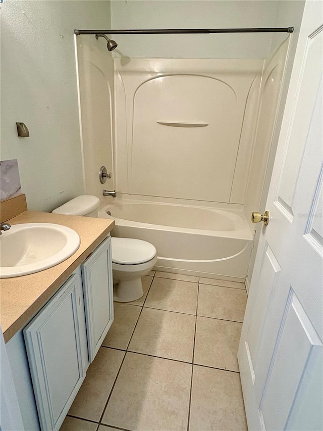 bathroom featuring toilet, tile patterned flooring, shower / tub combination, and vanity