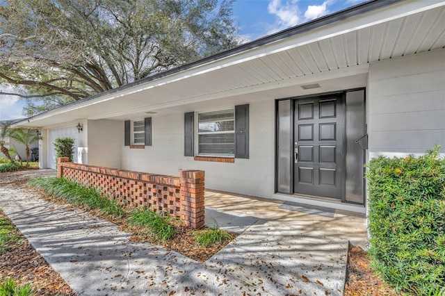 property entrance featuring a garage