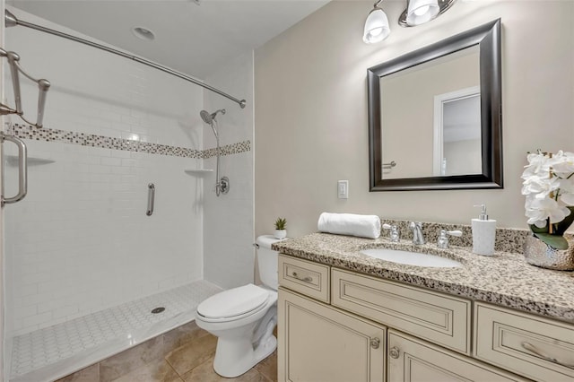 full bathroom with toilet, tile patterned flooring, a shower stall, and vanity