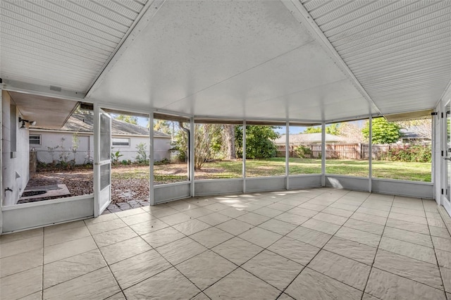 unfurnished sunroom with a wealth of natural light