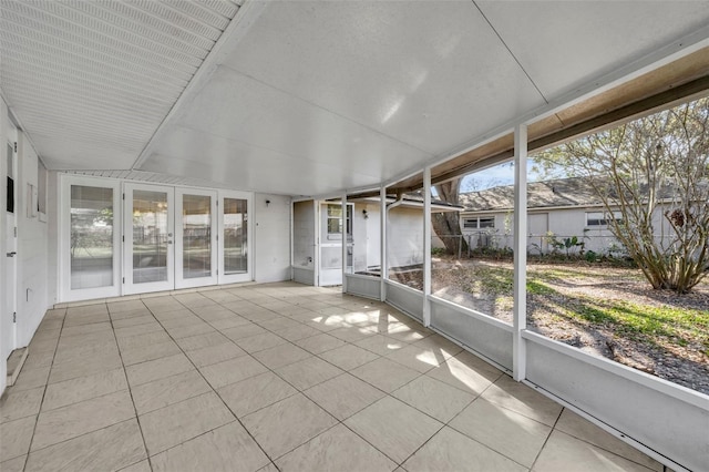 unfurnished sunroom with a wealth of natural light