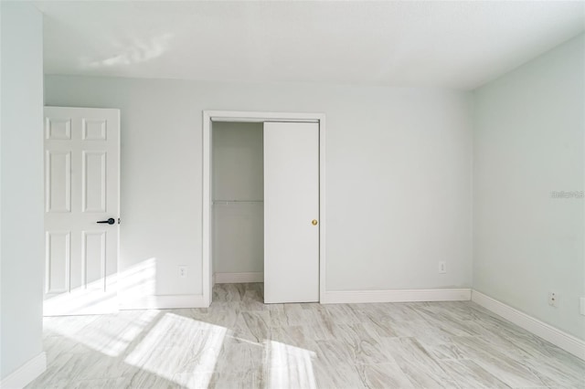 unfurnished bedroom with a closet