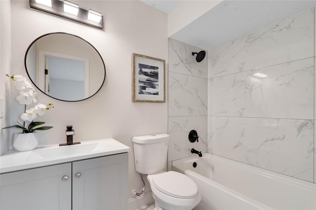 full bathroom featuring toilet, vanity, and tiled shower / bath combo