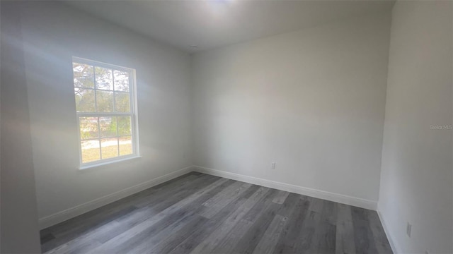 spare room featuring dark hardwood / wood-style floors