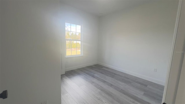 unfurnished room featuring light hardwood / wood-style flooring