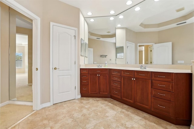 bathroom with recessed lighting, visible vents, a sink, and double vanity