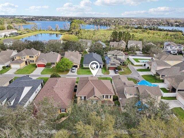 birds eye view of property featuring a water view and a residential view