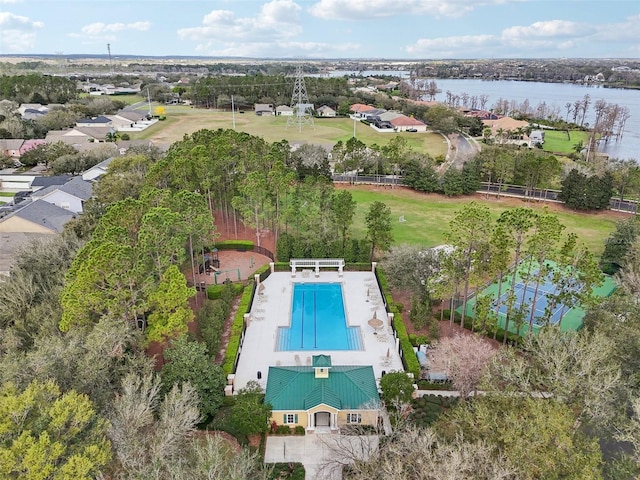 birds eye view of property with a water view