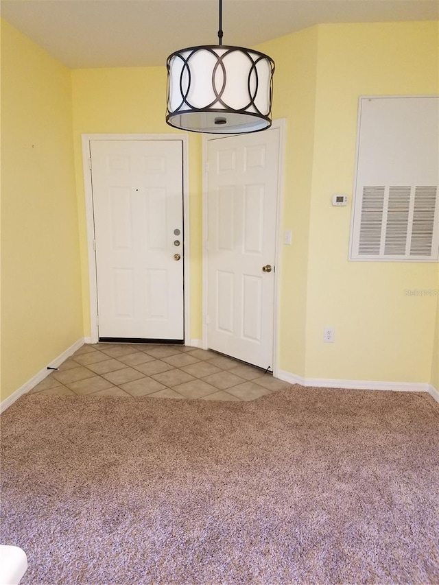 5455 Vineland Rd Unit 3303, Orlando, FL 32811 - entrance foyer with carpet flooring and tile patterned floors