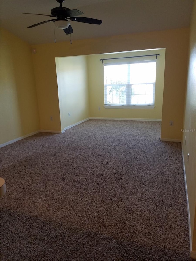 5455 Vineland Rd Unit 3303, Orlando, FL 32811 - carpeted empty room featuring a ceiling fan and baseboards
