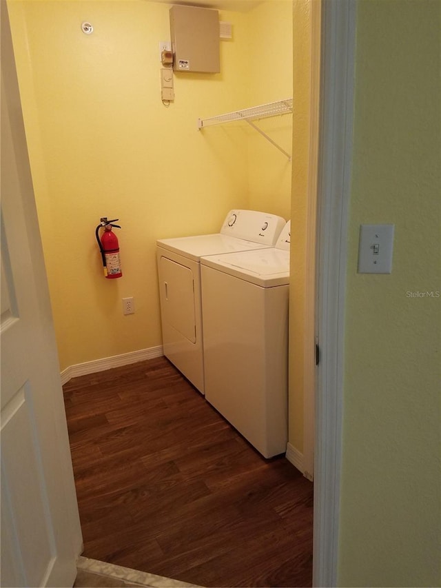 5455 Vineland Rd Unit 3303, Orlando, FL 32811 - washroom featuring dark wood-style floors and washer and clothes dryer