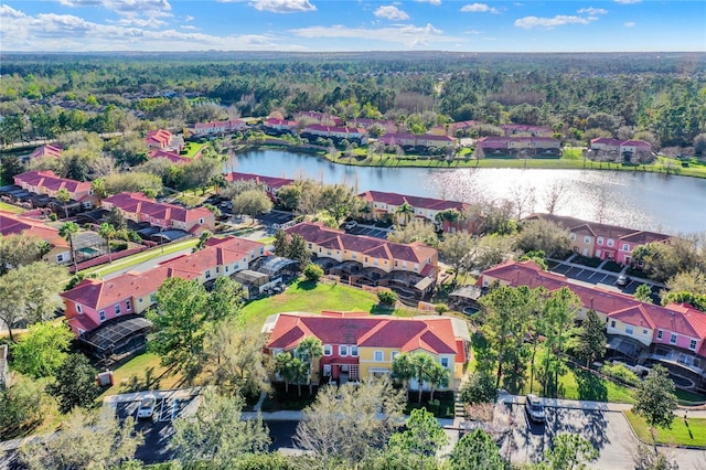 bird's eye view featuring a water view and a residential view