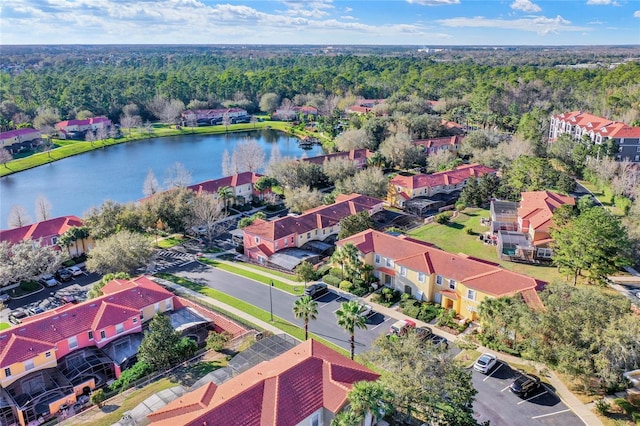 bird's eye view featuring a water view, a residential view, and a view of trees