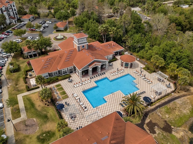 pool featuring fence and a patio