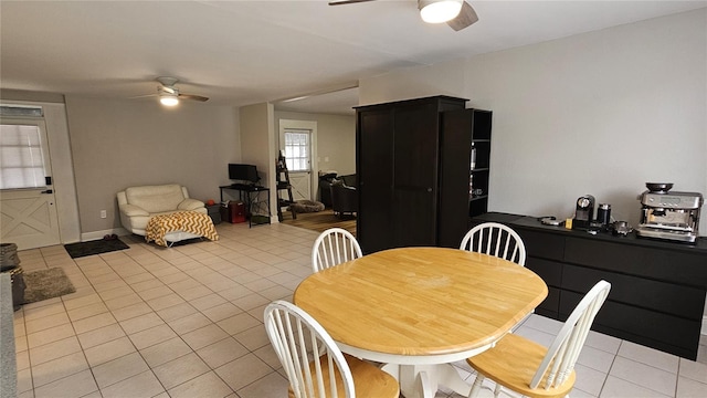 tiled dining room with ceiling fan