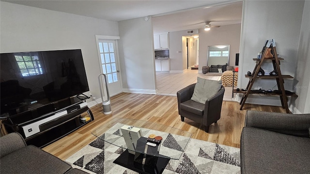 living room with light hardwood / wood-style flooring