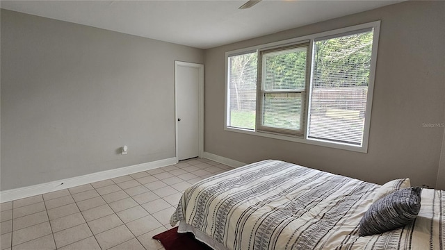 bedroom featuring light tile patterned floors