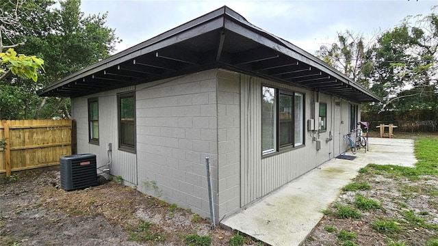 view of property exterior with central AC unit