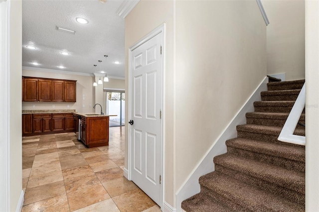 stairs featuring ornamental molding, recessed lighting, a textured ceiling, and baseboards