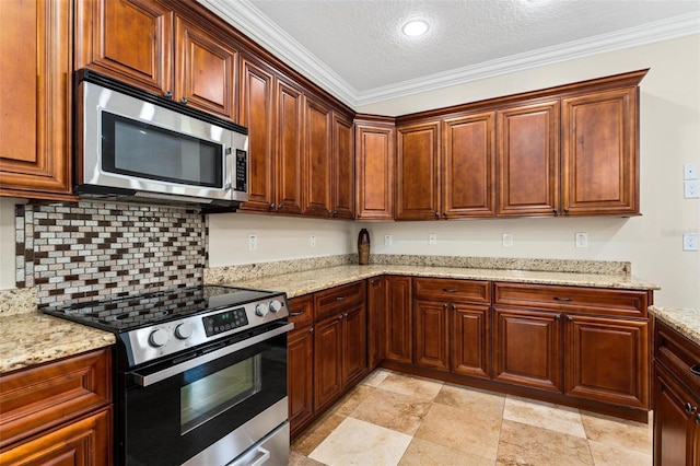 kitchen featuring a textured ceiling, light stone counters, stainless steel appliances, ornamental molding, and decorative backsplash