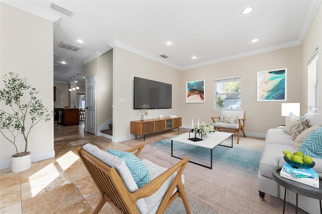 living room with visible vents and crown molding