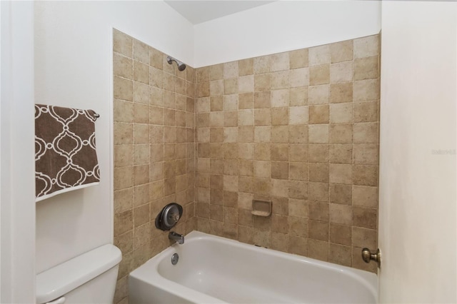 bathroom with toilet and bathing tub / shower combination