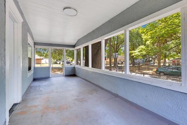 unfurnished sunroom featuring healthy amount of natural light