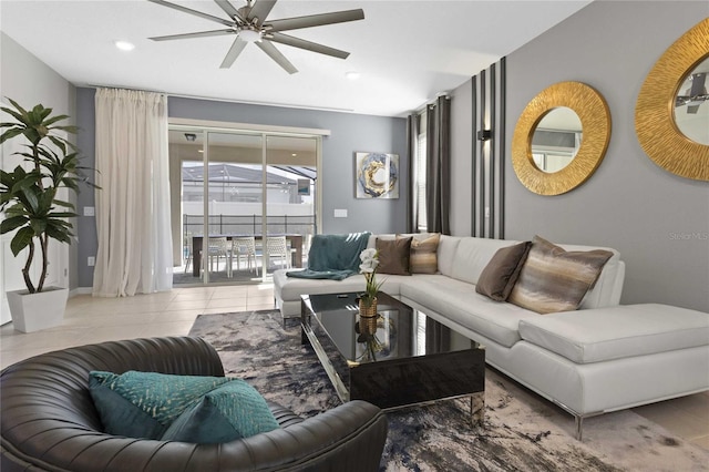 living room with ceiling fan and light tile patterned floors