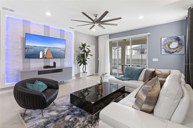 tiled living room with ceiling fan