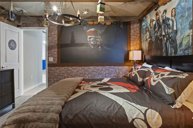 bedroom featuring carpet flooring and brick wall