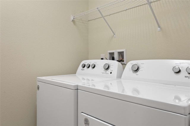 laundry area with separate washer and dryer